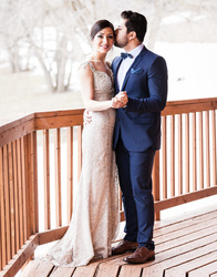 full body groom kissing bride