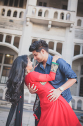 engaged Indian couple dancing
