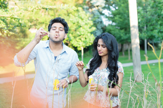 couple blowing bubbles