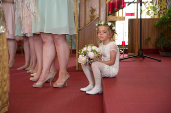 flower girl sitting on church stair