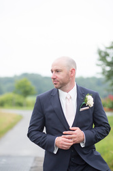 groomsmen holding his wedding ring