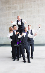 groomsmen carrying the groom