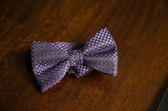 close-up of purple silk bowtie