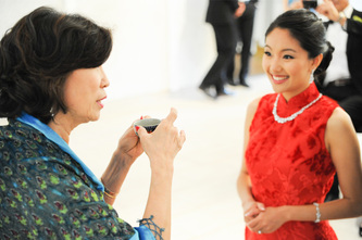 chinese bride receiving blessings during wedding tea ceremony