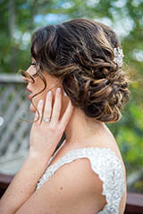 outdoor side portrait of the bride highlighting her hair and jewelry