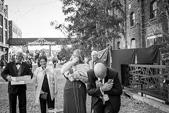 close family crying during the wedding photo shoot in distillery in Toronto