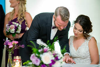 bride and groom signing their wedding certificate at twist gallery in Toronto