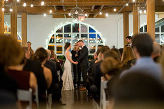 bride and groom during the wedding ceremony in twist gallery in Toronto