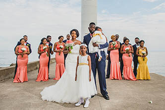 bride groom two daughters and the bridal party at the oakville waterfront